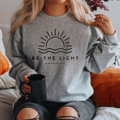 Fudus | Stijlvolle Sweater "BE THE LIGHT"