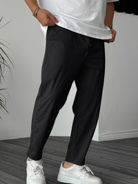 Oscar | Elegante Konisch Zulaufende Hose Mit Kordelzug in Schwarz