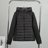 Damen leichte Hybrid-Steppjacke mit Kapuze und elastischen Ärmelpaneelen in Schwarz
