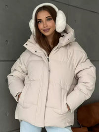 Damen Oversized Steppjacke mit Kapuze und integrierten Taschen in Aprikosenfarbe
