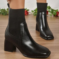 Damen Schlupf-Stiefeletten mit Blockabsatz und Strickschaft in Schwarz