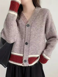 Damen Langarm Strickjacke mit V-Ausschnitt und Drei-Knopf-Leiste in melierter Oberfläche in Mauve