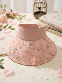 Faltbarer Strohhut mit Blumenakzent und UV-Schutz in Rosa